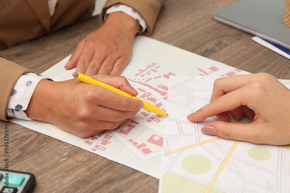 Real estate agent working with client at wooden table, closeup Real estate agent working with client at wooden table, closeup