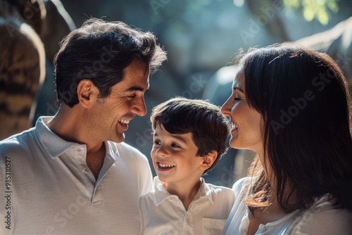 High-resolution brightly lit photorealistic candid photograph of a father, mother, and son smiling at each other while standing in front of a zoo exhibit, with a soft, creamy bokeh background. The