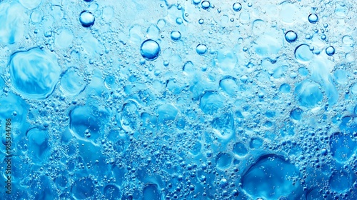 Close-up of vibrant blue bubbles on a water surface, showcasing the beauty and complexity of liquid forms and textures.