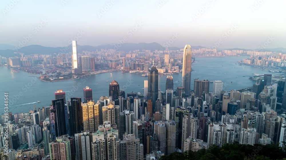 HONG KONG, CHINA - November 26, 2023: Hong Kong, China, Time lapse view of famous Hong Kong skyline and Victoria Harbour at high mountian. Timelapse Cityscape Hong Kong. Footage b roll. HONG KONG, CHINA - November 26, 2023: Hong Kong, China, Time lapse view of famous Hong Kong skyline and Victoria Harbour at high mountian. Timelapse Cityscape Hong Kong. Footage b roll.