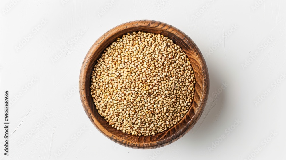 A bowl of quinoa is sitting on a white background A bowl of quinoa is sitting on a white background