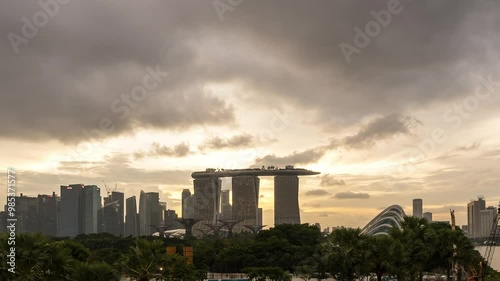 Singapore - August 25, 2023 : Time lapse of downtown district Singapore and Marina bay sand. Timelapse view of Marina Bay with its illuminated skyscrapers at sunset. Timelapse Day to night City.