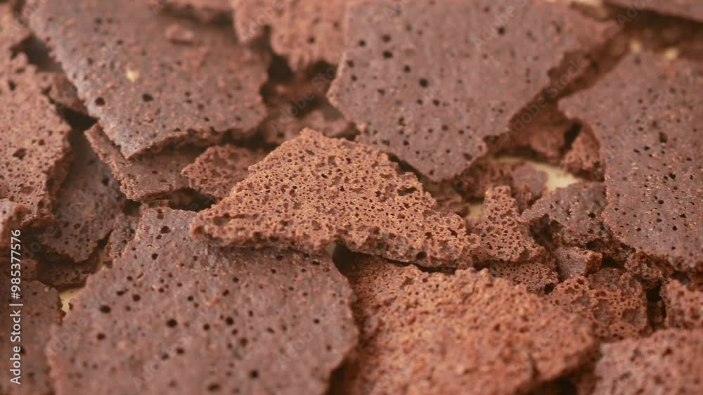 CloseUp View of Chocolate Bark Featuring a Textured Surface with Distinct Air Pockets CloseUp View of Chocolate Bark Featuring a Textured Surface with Distinct Air Pockets