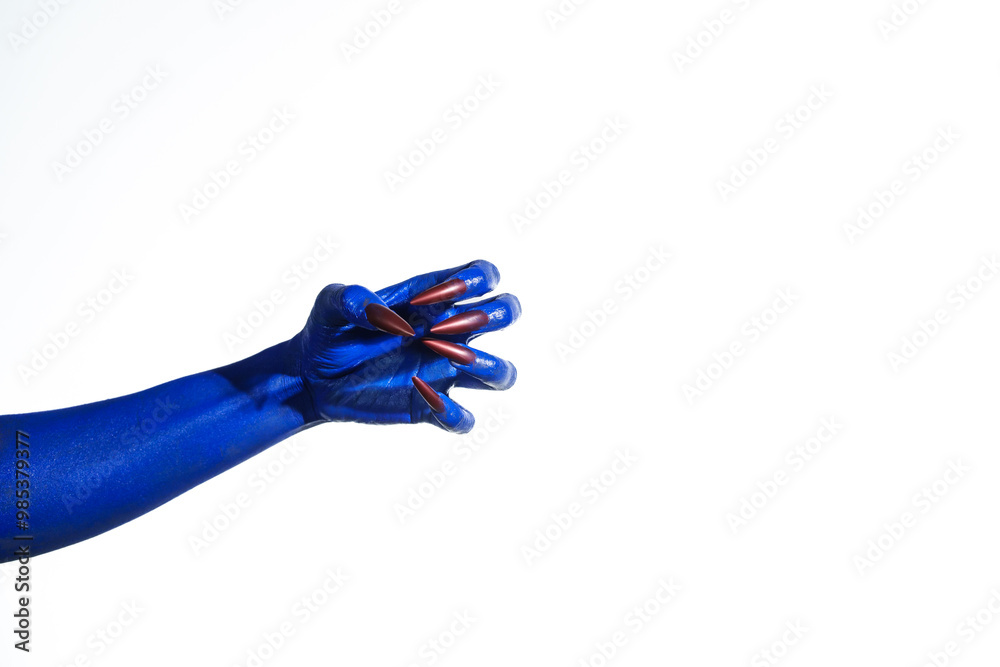 A witch's blue hand with sharp red nails on a white background. It exudes a demonic, monstrous vibe, blending vampire, alien, and ghostly features, creating a perfect Halloween horror image. A witch's blue hand with sharp red nails on a white background. It exudes a demonic, monstrous vibe, blending vampire, alien, and ghostly features, creating a perfect Halloween horror image.