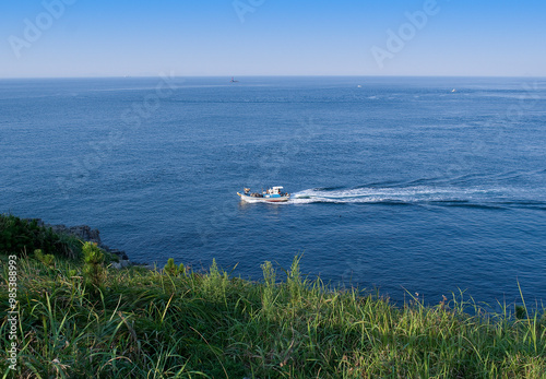 Geomundo Island, Yeosu-si, Jeollanam-do, South Korea - October 23, 2015: Fishing boat is runnig on the sea near Seodo Island photo