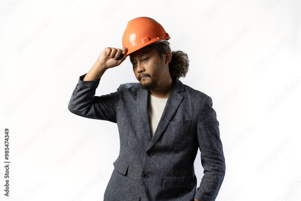 project leaders who look tired and pessimistic. stylish asian man with orange suit and helmet on white background. construction or mining business concept photo project leaders who look tired and pessimistic. stylish asian man with orange suit and helmet on white background. construction or mining business concept photo