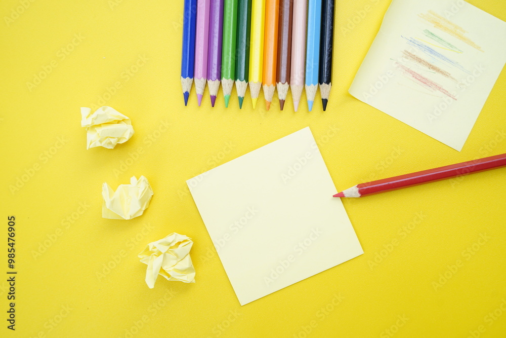 Colorful Pencils and Sticky Notes on Yellow Background Colorful Pencils and Sticky Notes on Yellow Background