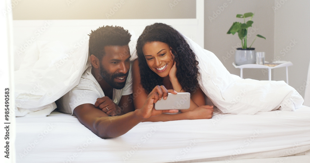 Obraz premium Black couple, selfie and bed with happy, smile and profile picture on wedding anniversary at morning. Bedroom, tech and people with post, social media and update with marriage, love and support