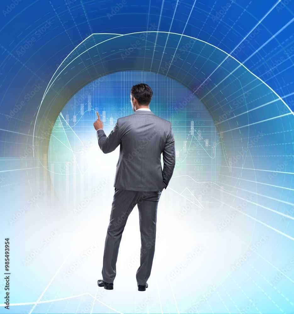 Businessman pressing virtual buttons in futuristic concept Businessman pressing virtual buttons in futuristic concept