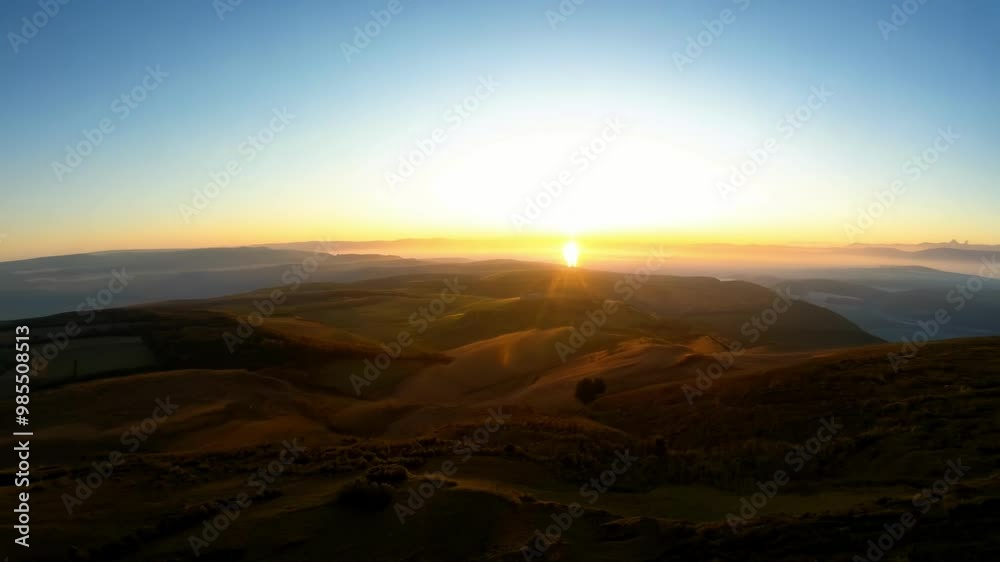 A serene sunrise view over rolling hills, capturing the beauty of dawn and the golden horizon. Perfect for scenes evoking tranquility, nature, and the start of a new day. A serene sunrise view over rolling hills, capturing the beauty of dawn and the golden horizon. Perfect for scenes evoking tranquility, nature, and the start of a new day.