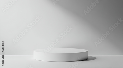 White round podium in white room with shadow on the wall,Abstract minimal scene with geometric shapes,White room with shadow from the light from the window