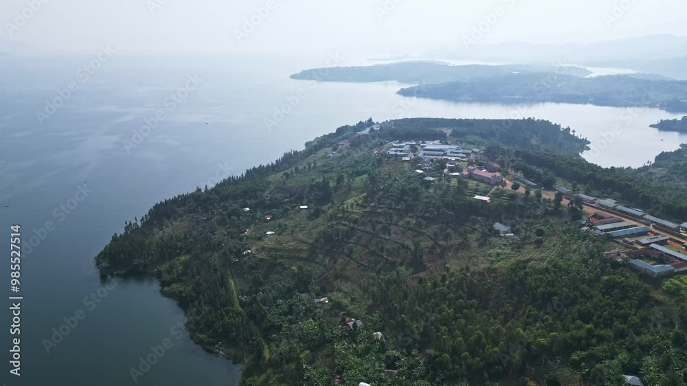 Tranquil Lake Victoria framed by majestic mountains, Africa, Uganda Tranquil Lake Victoria framed by majestic mountains, Africa, Uganda