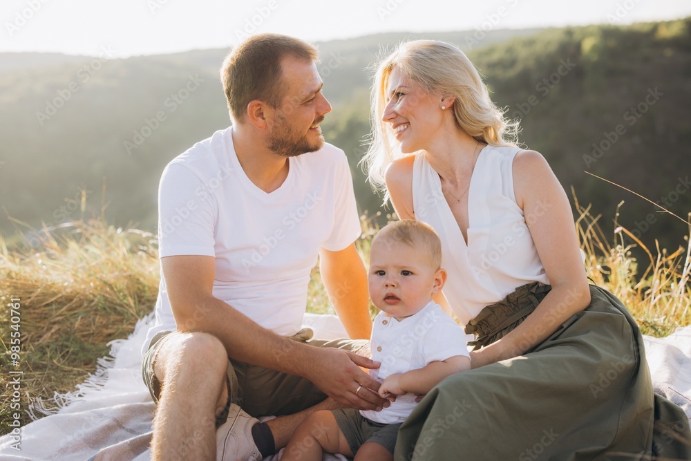 Happy Family Enjoying Quality Time Outdoors on a Sunny Day in Nature Happy Family Enjoying Quality Time Outdoors on a Sunny Day in Nature