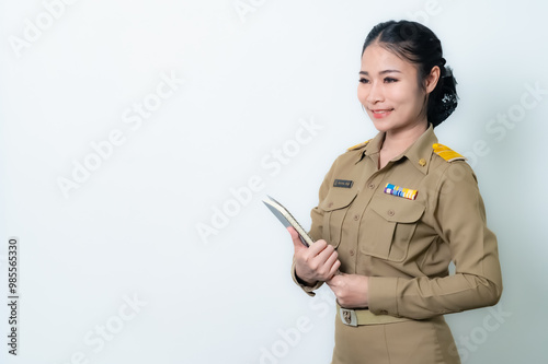 Female Thai government officer in khaki uniforms smiling. Beautiful woman doing winner gesture with arms raised isolated over white background. Concept