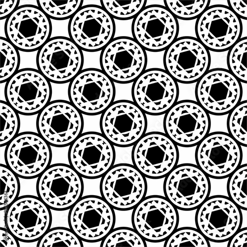 Seamless abstract circle and hexagon design pattern. Used for design surfaces, fabrics and textiles.