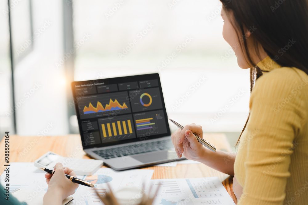 woman analyzing data on laptop with graphs and charts, focused on performance. woman analyzing data on laptop with graphs and charts, focused on performance.