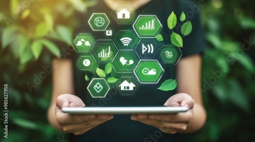 A tablet is being held up to a green background with a variety of icons