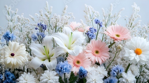 Mourning Flowers Arrangement with White Lilies,Asters,Roses and Vibrant Blue Accents on a Minimal photo