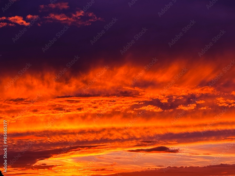 Sunset dusk sundown sky heaven fiery glowing clouds.