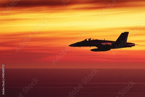 a fighter jet silhouetted against a fiery sunset