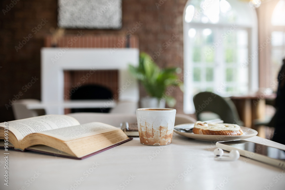 Retro coffee cup with breakfast and old book is opening on white table by the window in cafe Retro coffee cup with breakfast and old book is opening on white table by the window in cafe