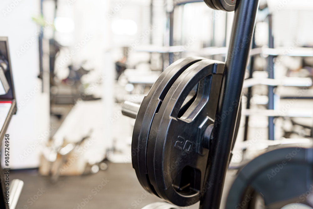 Weight plates on a rack in a gym for fitness and bodybuilding. Weight plates on a rack in a gym for fitness and bodybuilding.