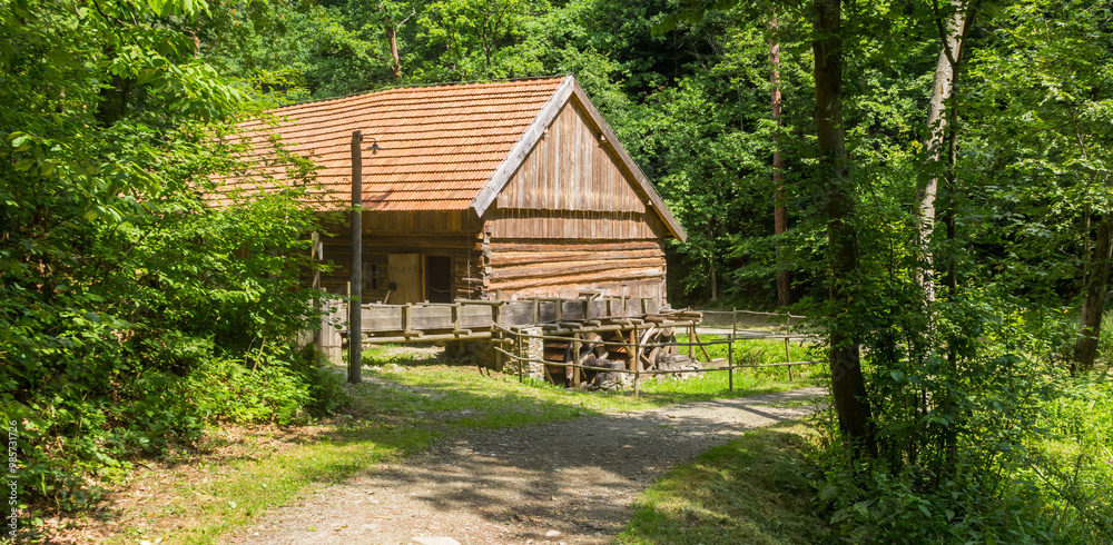 Panorama of a wooden water mill in the forest of Nowy Sacz, Poland