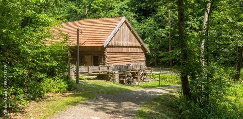 Obraz na płótnie Panorama of a wooden water mill in the forest of Nowy Sacz, Poland w salonie