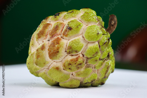 Close-Up of a Single Cherimoya Fruit photo