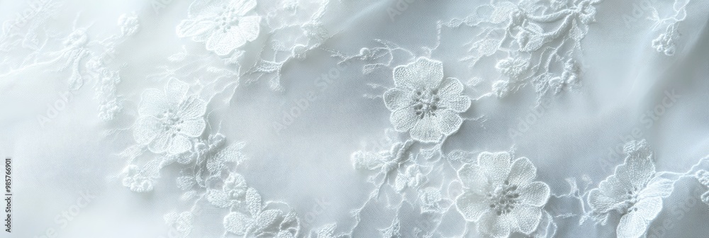 Fototapeta premium Intricate lace fabric texture in delicate white, creating floral patterns