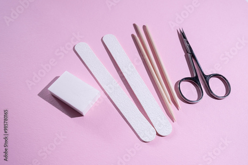 Manicure and pedicure tools composition, flat lay. Nail polish, file, scissors. Professional nail care equipment. Beauty care concept