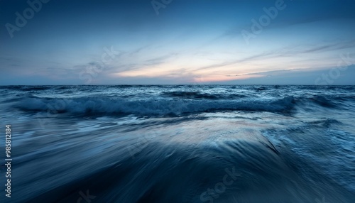 Calm ocean waves at twilight.