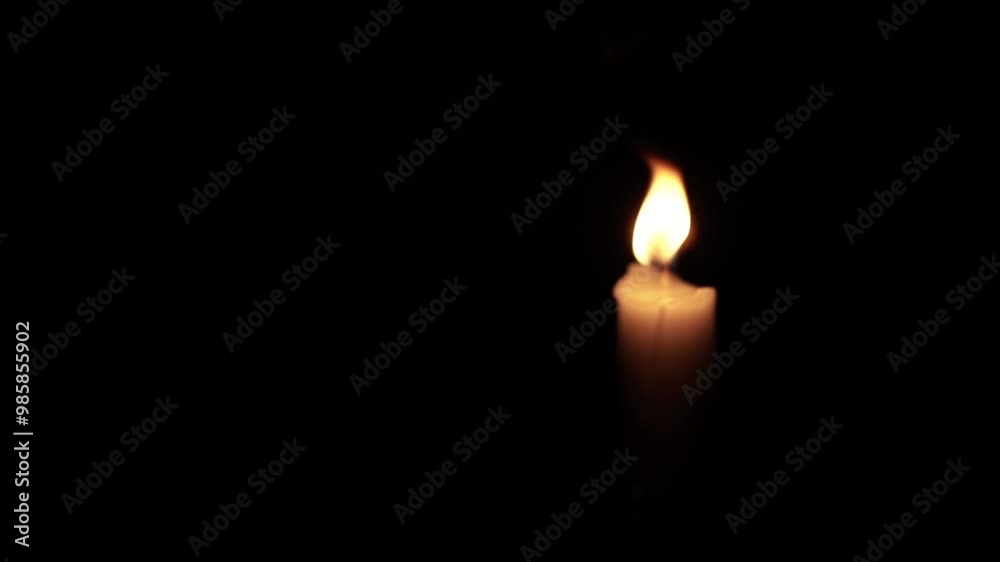 Taper Candle Burning in Darkness