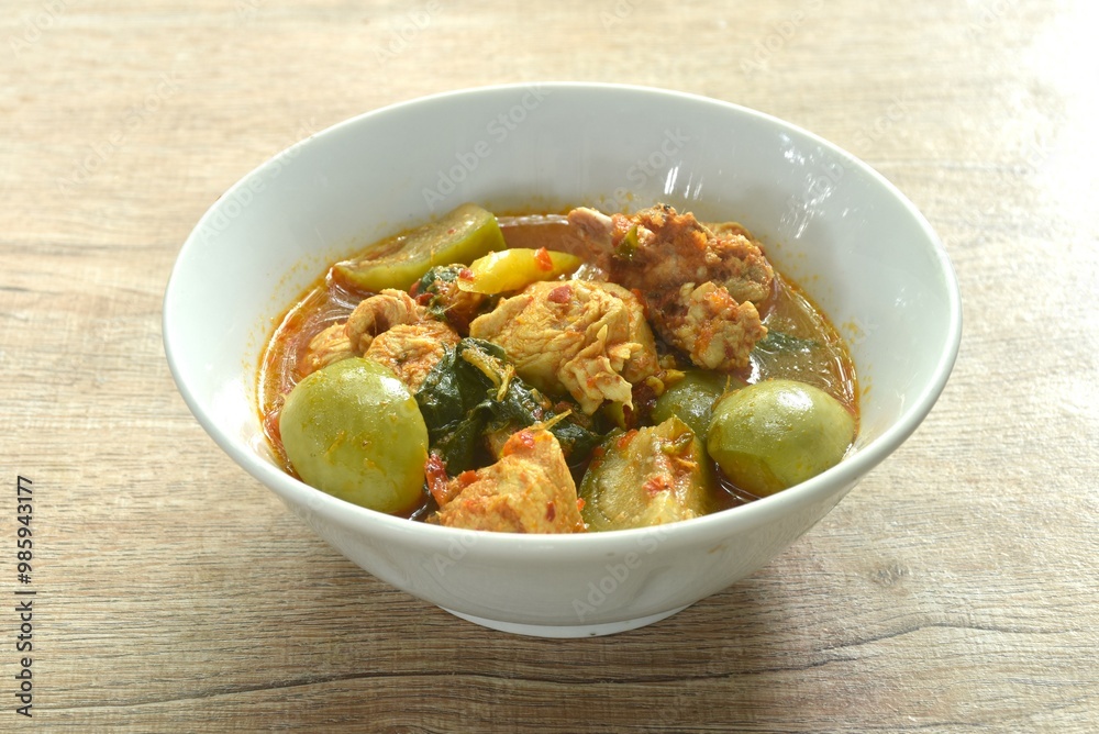 spicy boiled chicken with mixed vegetable in jungle curry soup Thai food in bowl spicy boiled chicken with mixed vegetable in jungle curry soup Thai food in bowl