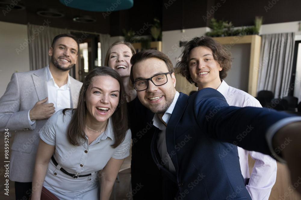 Excited joyful business group celebrating corporate success, high teamwork result, team achieve, feeling joy, having fun, looking at camera, smiling, taking selfie. Office self portrait