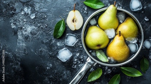 Leaves and ice bathe pears in a pan on a stone table. photo