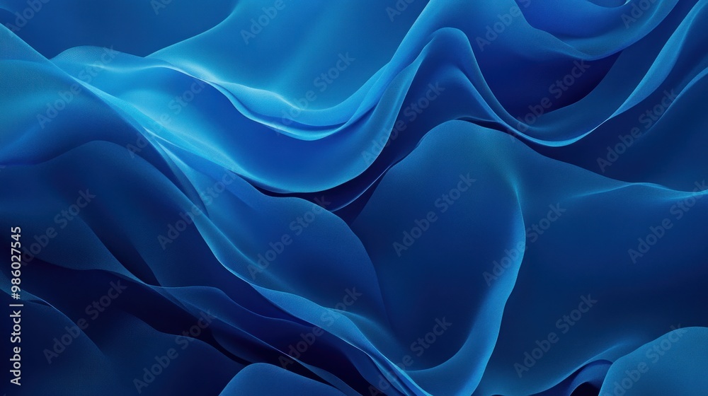 Obraz premium Abstract blue waves create a smooth, flowing texture, evoking calm and serenity.