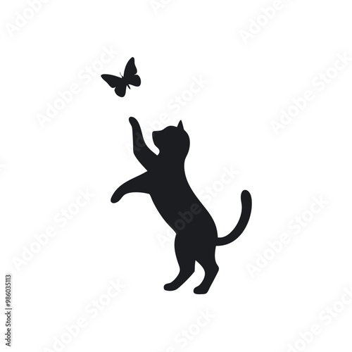 a cat standing on its hind legs with its front paws up in the air. The cat appears to be reaching up towards a small butterfly that is flying in front of it