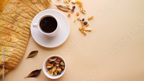 White cup with coffee and with autumn colors