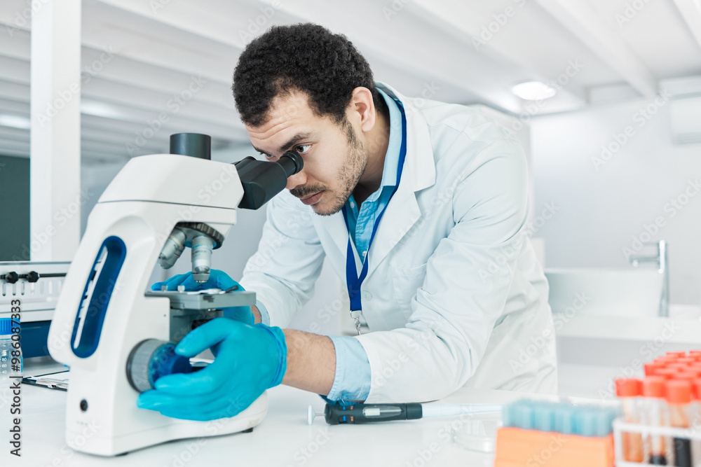 Laboratory, scientist or man with microscope for research, checking and analysis for science study. Healthcare, male doctor and investigation with biotechnology for dna test, review and observation Laboratory, scientist or man with microscope for research, checking and analysis for science study. Healthcare, male doctor and investigation with biotechnology for dna test, review and observation