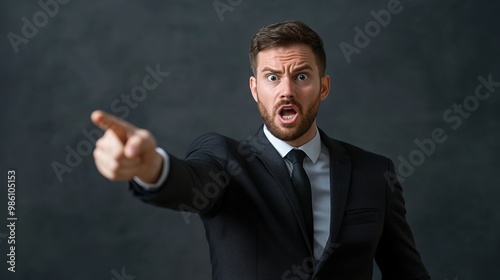 Angry businessman pointing with frustration