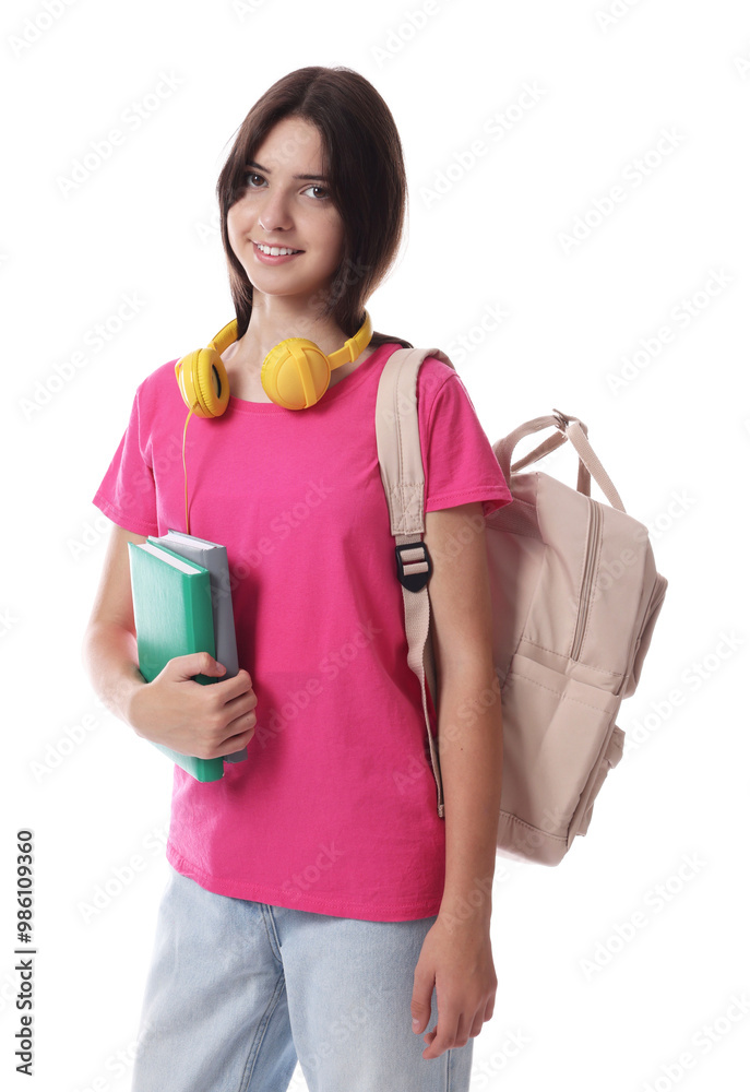 Portrait of smiling teenage girl with backpack and books on white background Portrait of smiling teenage girl with backpack and books on white background