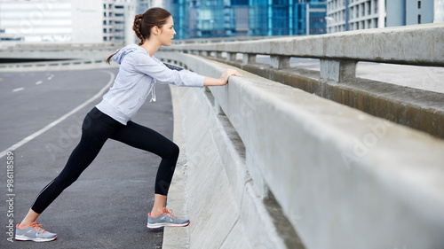 Woman, city and warm up for fitness on street, bridge challenge and morning for cardio workout. Female person, stretching and urban town for muscle relief, outdoor and athlete for start of training