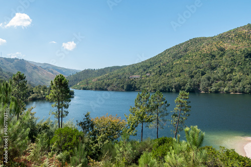 Vista panorâmica sobre o Rio Lima no Gerês rodeado por montanhas cobertas por verdes florestas em Portugal photo