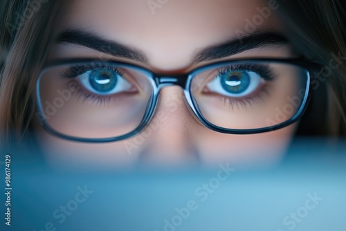 Close-Up of Female Office Worker's Eyes and Laptop