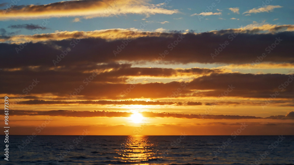 Blurred bokeh of a sunrise over a calm ocean Blurred bokeh of a sunrise over a calm ocean