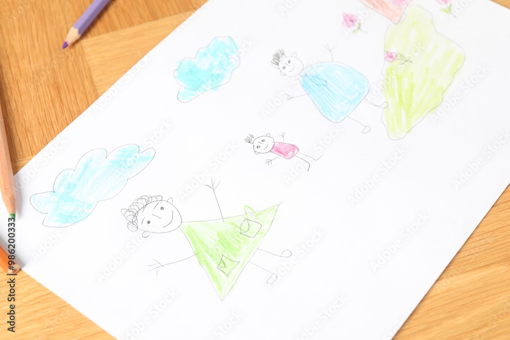 Child`s picture and pencils on wooden table, closeup Child`s picture and pencils on wooden table, closeup