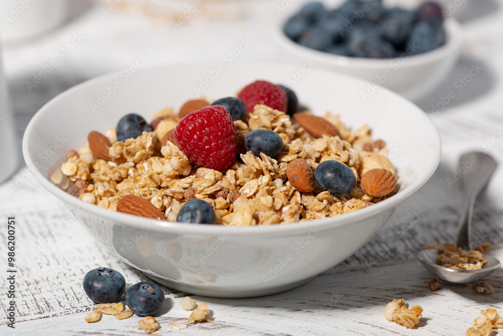 homemade granola with nuts and fresh berries, closeup homemade granola with nuts and fresh berries, closeup