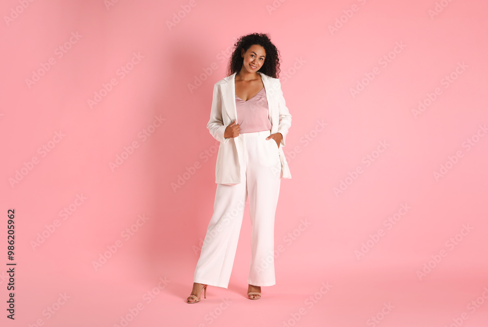 Beautiful woman in stylish suit on pink background Beautiful woman in stylish suit on pink background