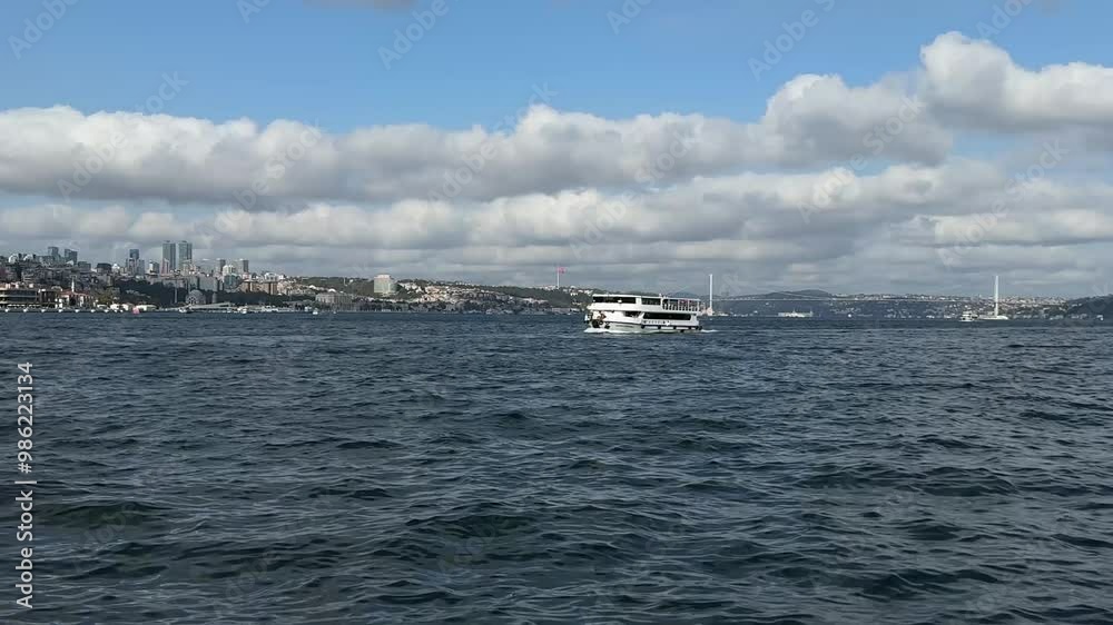 A ship sailing in the Bosphorus Strait A ship sailing in the Bosphorus Strait